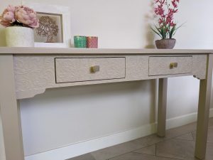 Console table upcycled with Fusion Cathedral Taupe paint and textured floral wallpaper