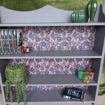 bookcase upcycled with purple paint and paisley material