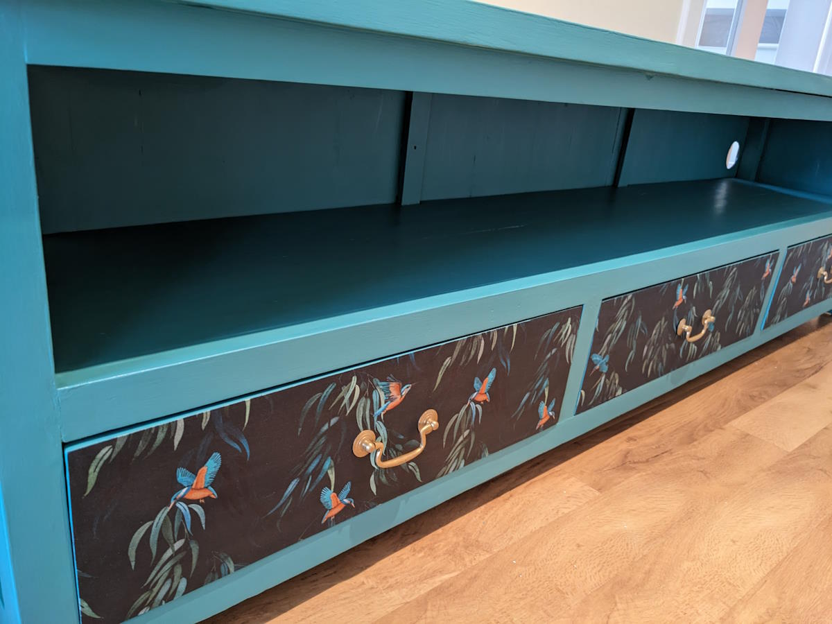 dark furniture painted teal with decoupaged drawers