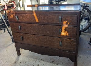 dark wooden chest of drawers