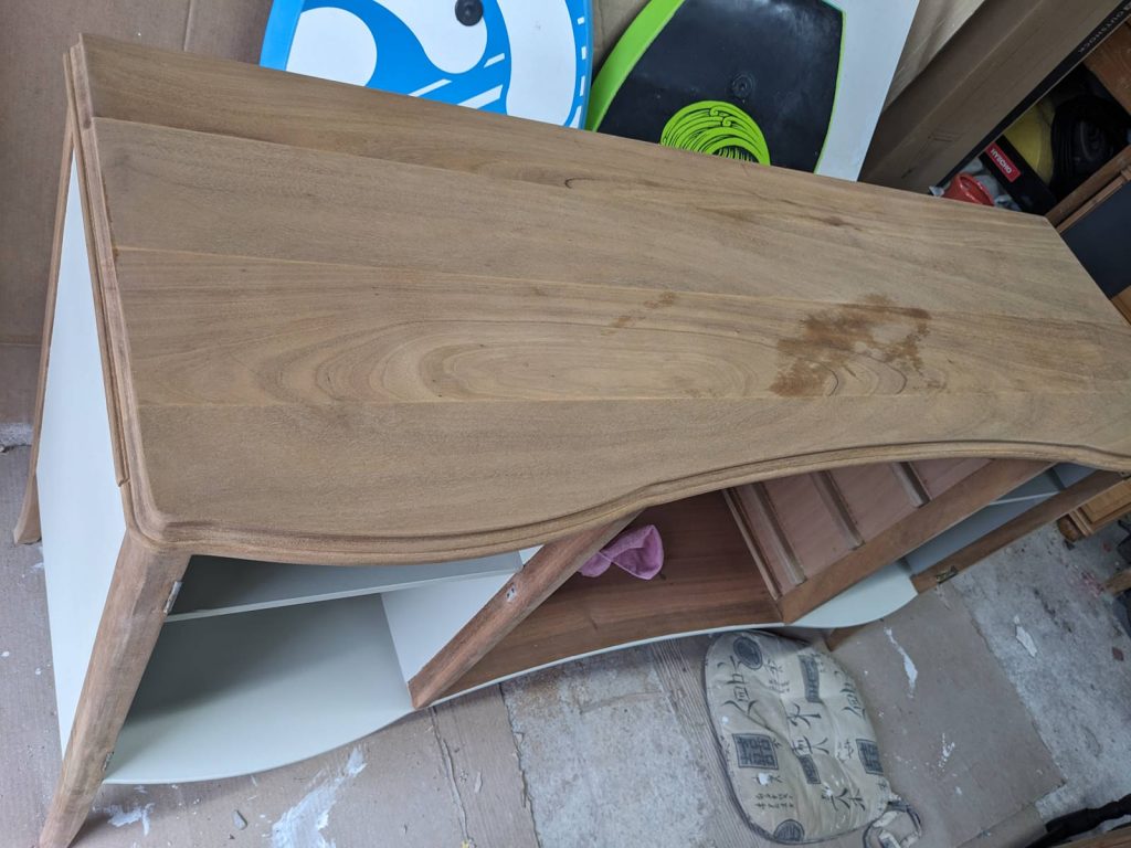 sanding wooden top to reveal beautiful wood grain