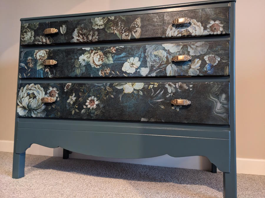 Teal floral chest of drawer with ornate handles